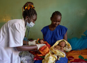 Midwife in South Sudan hospital Roseline Edwards Anthony, a midwife, checks Chan, one of Alek Kual's newborn twin boys, in the maternity ward of the St. Daniel Comboni Hospital in Wau, South Sudan. Chan's brother is named Noor.
Anthony is a graduate of the Catholic Health Training Institute, which is sponsored by Solidarity with South Sudan.